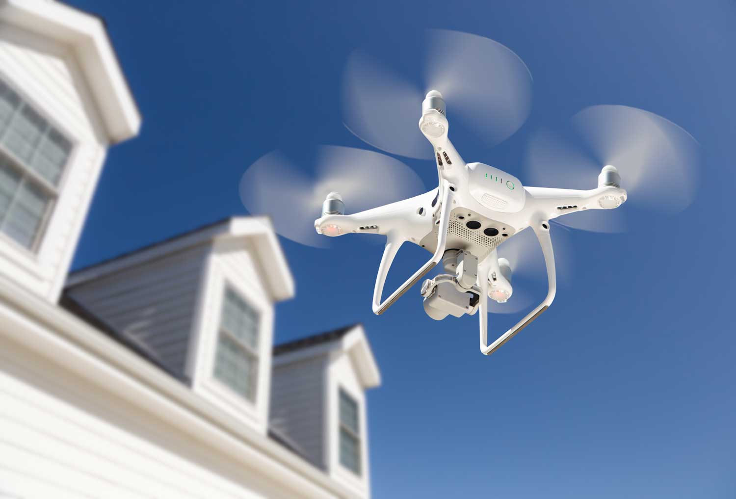 Drone flying exterior of house